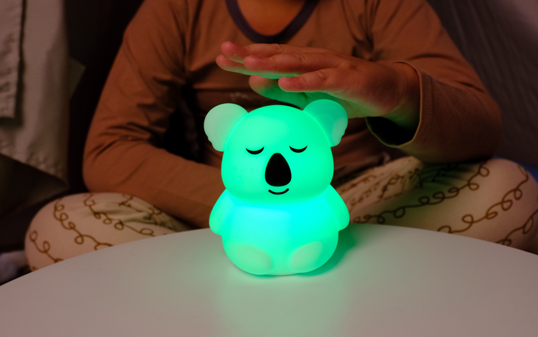 Child practicing 4-7-8 breathing with a Breathing Pal light at bedtime