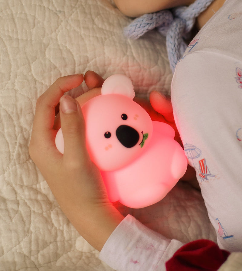 A Breathing Pal glowing in small hands
