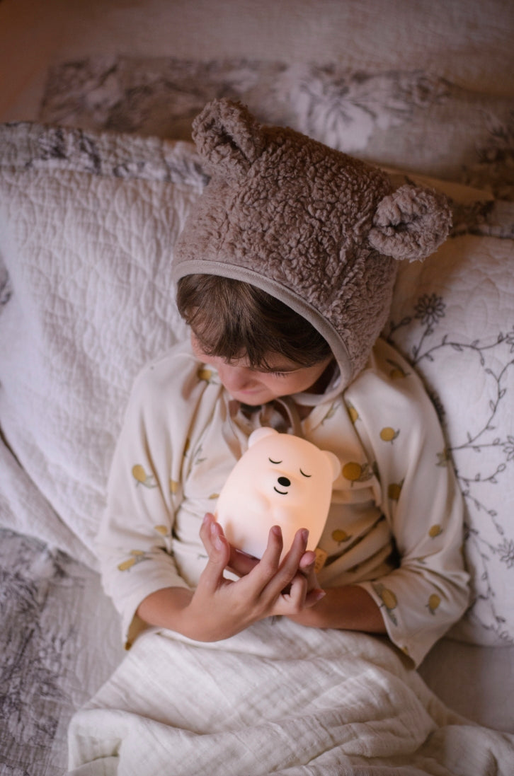 A child holding a glowing Breathing Pal
